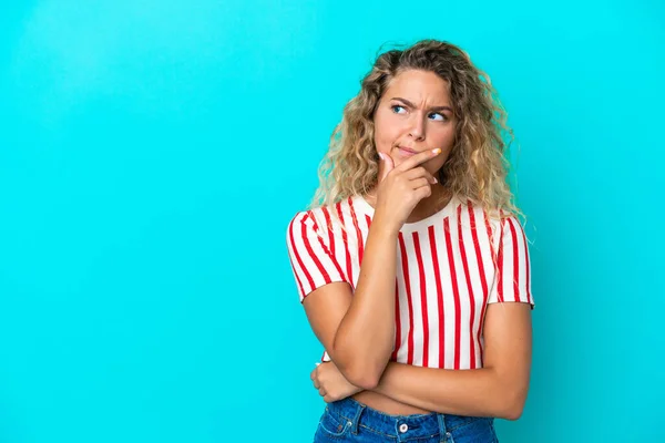 Girl Curly Hair Isolated Blue Background Having Doubts Confuse Face — Fotografia de Stock
