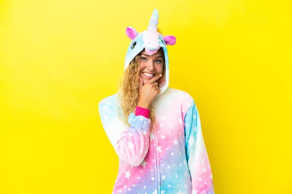 Girl Curly Hair Wearing Unicorn Pajama Isolated Yellow Background Smiling — Stockfoto