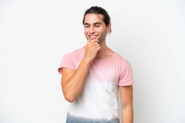 Caucasian handsome man isolated on white background looking to the side and smiling