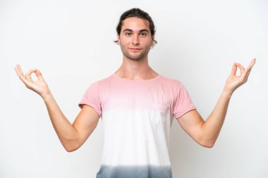 Caucasian handsome man isolated on white background in zen pose