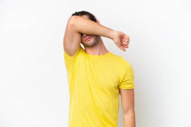 Caucasian handsome man isolated on white background covering eyes by hands