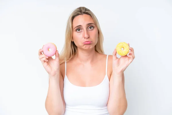 Young Caucasian Woman Isolated White Background Holding Donuts Sad Expression — Stock Photo, Image