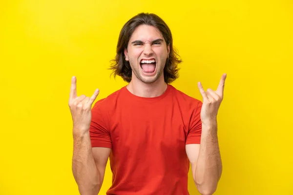 Caucasian Handsome Man Isolated Yellow Background Making Horn Gesture — Stockfoto