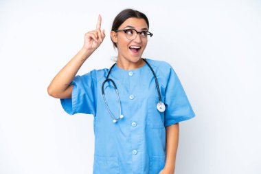 Young nurse woman isolated on white background intending to realizes the solution while lifting a finger up