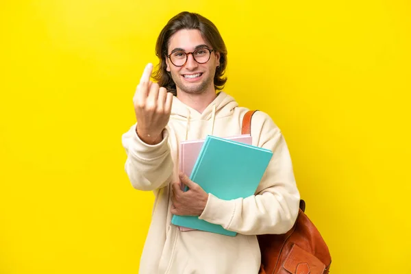 Young Student Handsome Man Isolated Yellow Background Doing Coming Gesture — Foto Stock