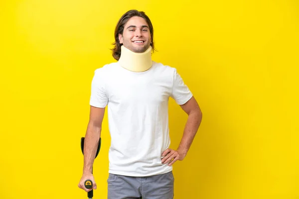 Young Handsome Man Wearing Neck Brace Crutches Isolated Yellow Background — Foto de Stock