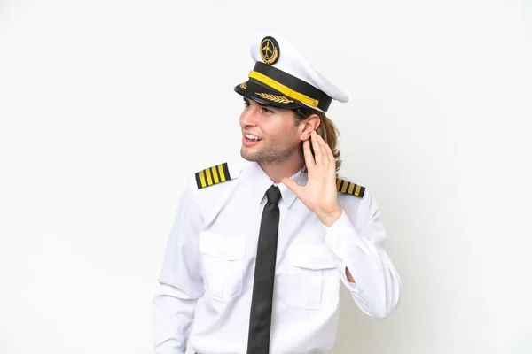 Handsome Airplane Pilot Isolated White Background Listening Something Putting Hand — Stockfoto