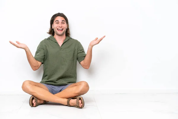 Young Handsome Man Sitting Floor Isolated White Background Shocked Facial — Stockfoto