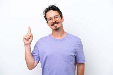 Young man with moustache isolated on white background showing and lifting a finger in sign of the best