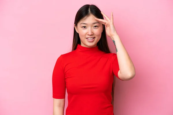 Young Chinese Woman Isolated Pink Background Saluting Hand Happy Expression —  Fotos de Stock