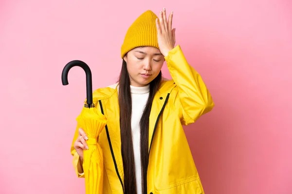 Young Chinese Woman Rainproof Coat Umbrella Isolated Pink Background Has —  Fotos de Stock