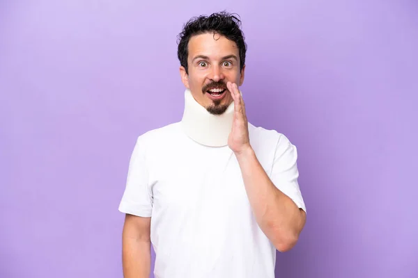 Young Caucasian Man Wearing Neck Brace Isolated Purple Background Surprise —  Fotos de Stock