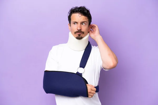 Young Caucasian Man Wearing Sling Neck Brace Isolated Purple Background —  Fotos de Stock