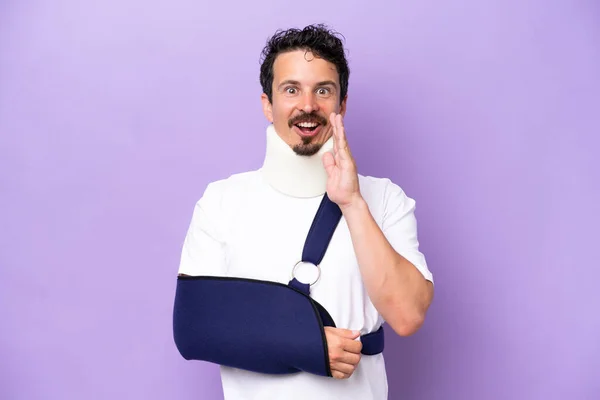 Young Caucasian Man Wearing Sling Neck Brace Isolated Purple Background —  Fotos de Stock