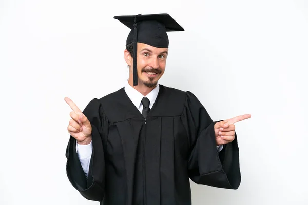 Young University Graduate Man Isolated White Background Pointing Finger Laterals — Stockfoto
