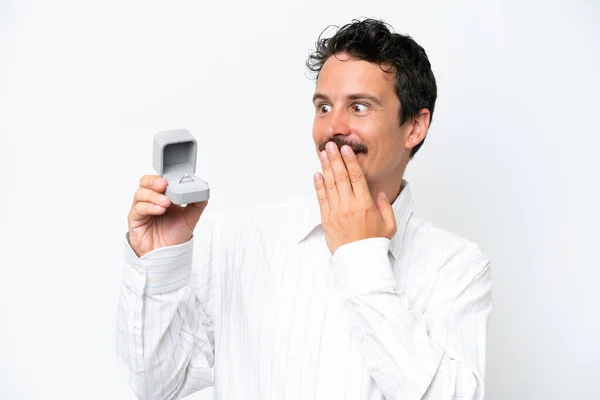 Young Man Holding Engagement Ring Isolated White Background Surprise Shocked — Stock fotografie