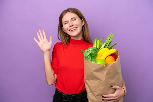 Young English Woman Holding Grocery Shopping Bag Isolated Purple Background — Stockfoto