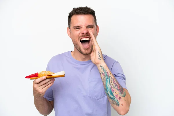 Young Caucasian Man Holding Sashimi Isolated White Background Shouting Mouth — Foto de Stock