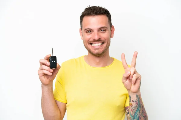 Young Man Holding Car Keys Isolated White Background Smiling Showing — Stock fotografie