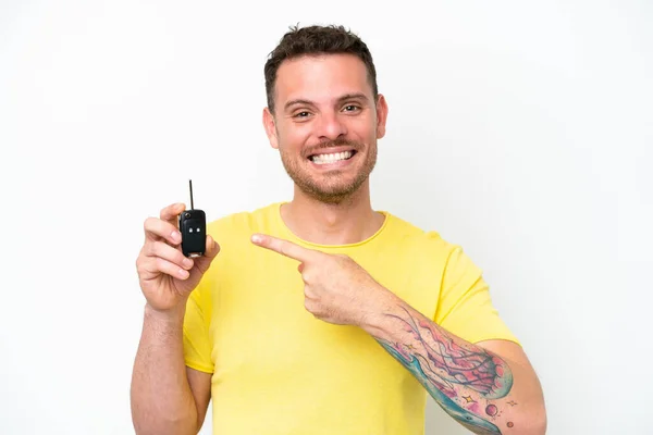 Young Man Holding Car Keys Isolated White Background Pointing — Foto Stock