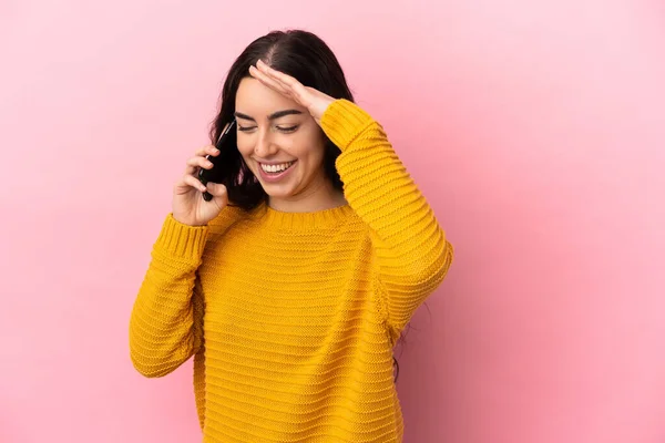 Young Caucasian Woman Using Mobile Phone Isolated Pink Background Laughing — Stockfoto