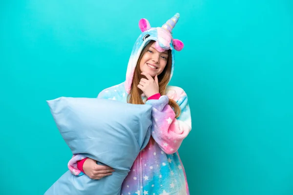 Young Caucasian Girl Unicorn Pajamas Holding Pillow Isolated Blue Background — Foto de Stock