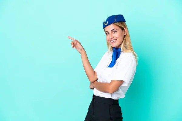Airplane Stewardess Uruguayan Woman Isolated Blue Background Pointing Finger Side — Photo