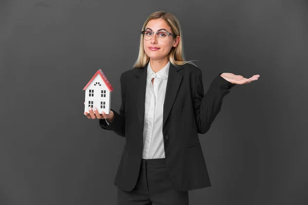 Blonde Uruguayan Girl Holding House Toy Isolated Black Background Having — Stock Fotó