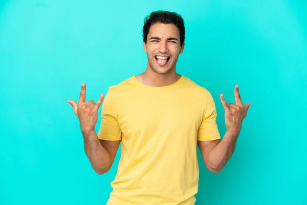 Caucasian Handsome Man Isolated Blue Background Making Horn Gesture — Zdjęcie stockowe