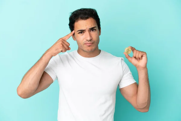 Young Man Holding Bitcoin Isolated Blue Background Having Doubts Thinking — Stockfoto