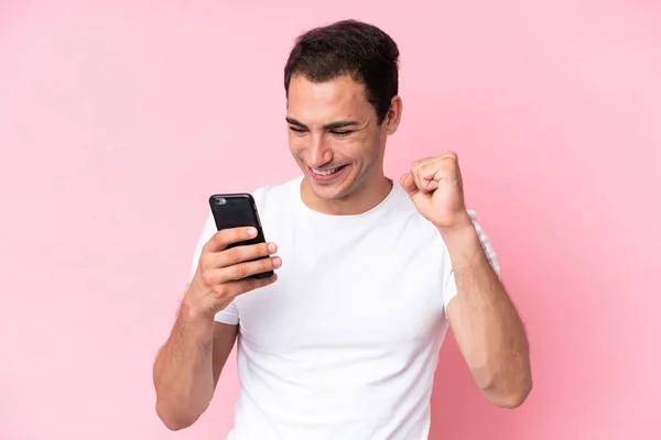 Young Caucasian Man Isolated Pink Background Using Mobile Phone Doing — Stockfoto