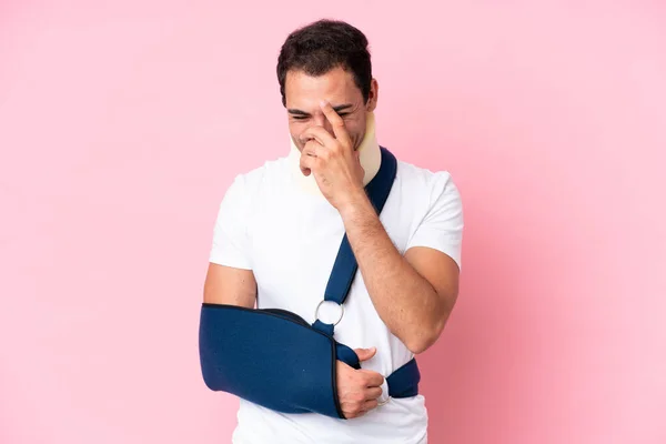 Young Caucasian Man Broken Arm Wearing Sling Isolated Pink Background — Stockfoto