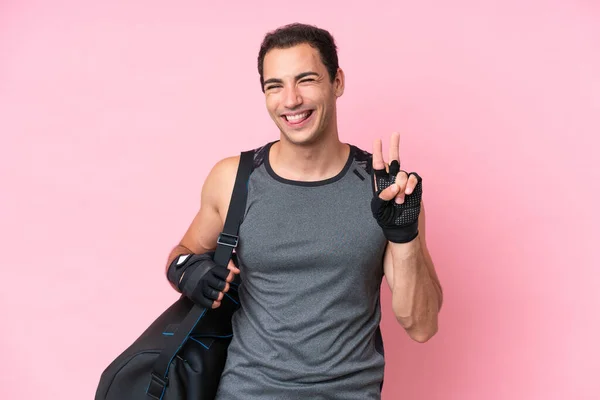 Young Sport Caucasian Man Sport Bag Isolated Pink Background Smiling —  Fotos de Stock