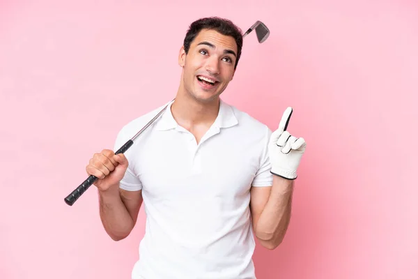 Young Golfer Player Man Isolated Pink Background Pointing Great Idea — Foto de Stock