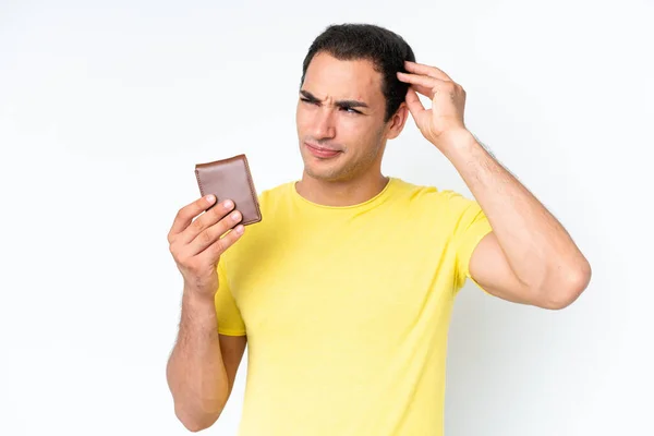 Young Caucasian Man Holding Wallet Isolated White Background Having Doubts — Stock fotografie