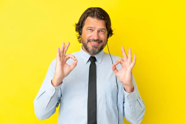 Telemarketer Dutch Man Working Headset Isolated Yellow Background Showing Sign — Stock Photo, Image