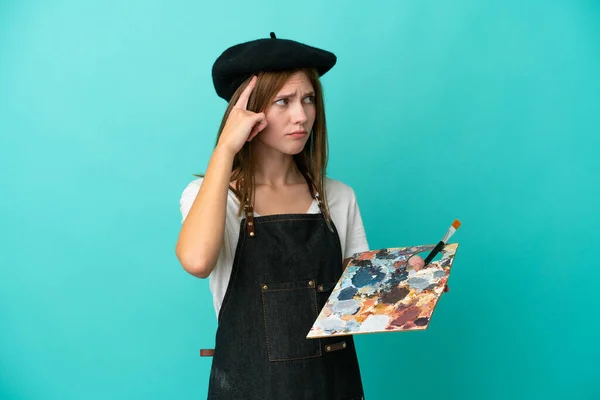 Jonge Kunstenaar Engels Vrouw Met Een Palet Geïsoleerd Blauwe Achtergrond — Stockfoto
