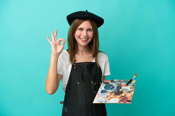 Młoda Artystka Angielski Kobieta Trzyma Paletę Odizolowanych Niebieskim Tle Pokazując — Zdjęcie stockowe