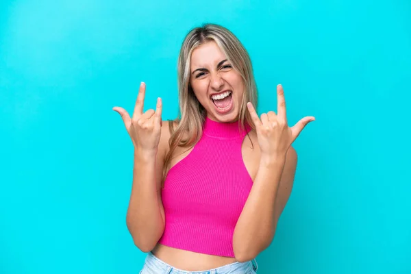 Young Caucasian Woman Isolated Blue Background Making Horn Gesture — Stock Photo, Image