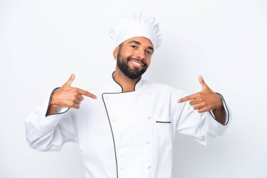 Young Brazilian chef man isolated on white background proud and self-satisfied