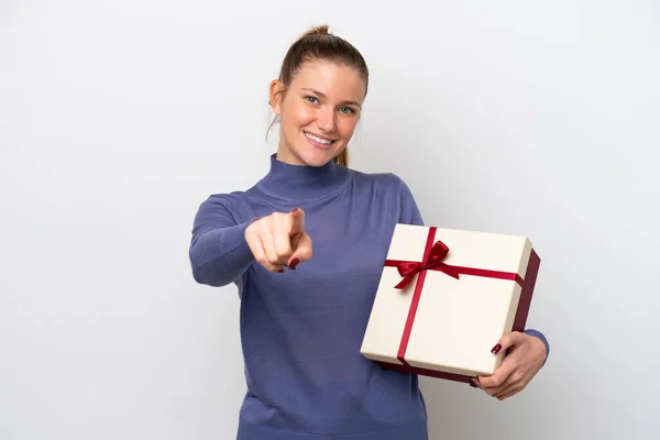 Young Caucasian Woman Holding Gift Isolated White Background Points Finger — Stockfoto