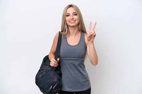 Spor Çantalı Genç Bayan Beyaz Arka Planda Izole Edilmiş Gülümsüyor — Stok fotoğraf