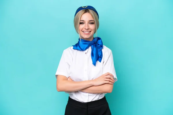 Airplane Blonde Stewardess Woman Isolated Blue Background Keeping Arms Crossed — Stock Photo, Image