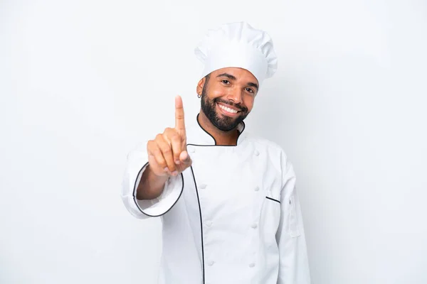 Young Brazilian Chef Man Isolated White Background Showing Lifting Finger —  Fotos de Stock