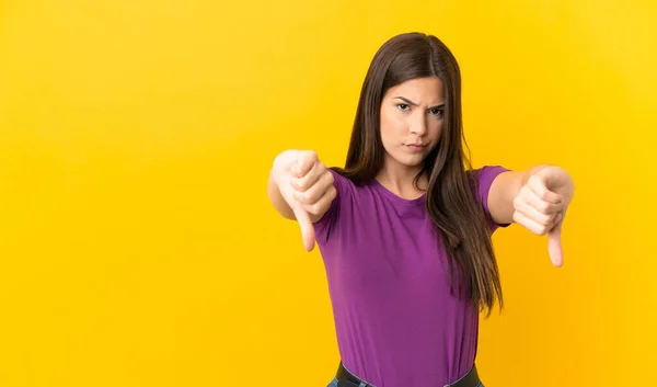 Teenager Brazilian Girl Isolated Yellow Background Showing Thumb Two Hands — Foto de Stock