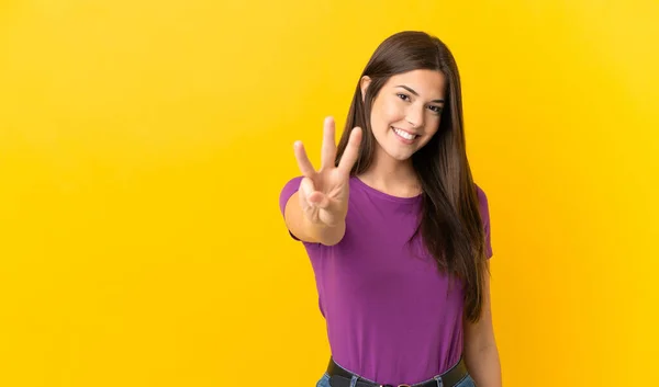 Teenager Brazilian Girl Isolated Yellow Background Happy Counting Three Fingers —  Fotos de Stock