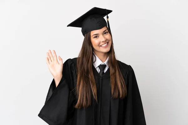 Teenager Brazilian University Graduate Isolated White Background Saluting Hand Happy — Stock Fotó