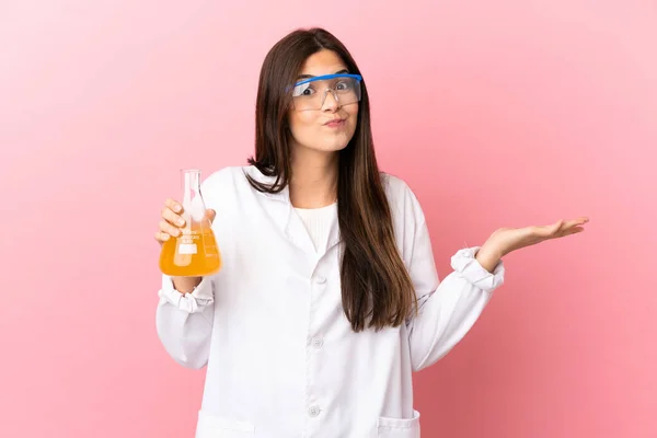 Young Scientific Girl Isolated Pink Background Having Doubts While Raising — Stockfoto