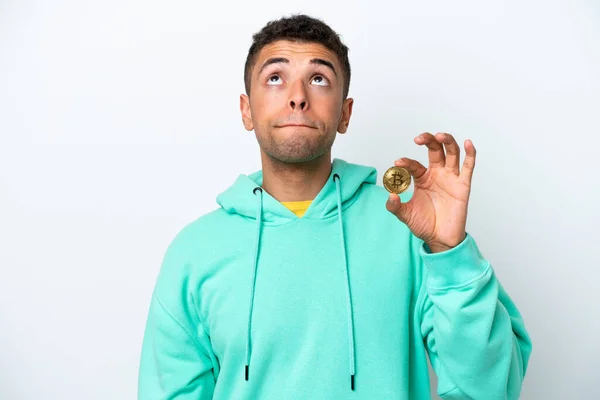 Young Brazilian Man Holding Bitcoin Isolated White Background Looking — 스톡 사진