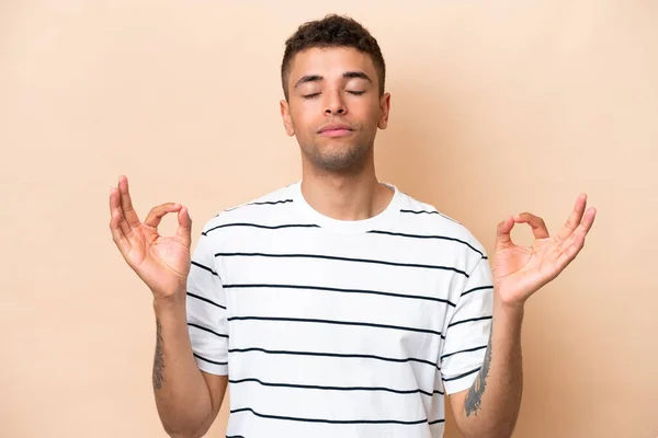 Young Brazilian Man Isolated Beige Background Zen Pose — Stock fotografie